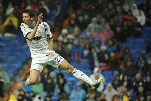 Real Madrid's Angel di Maria jumps for the ball at the Santiago Bernabeu stadium in Madrid on February 17, 2012